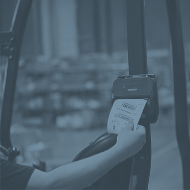 Rugged mobile printer producing a label on a forklift