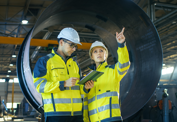 Manufacturing plant floor with rugged endpoint devices being managed by TRG technicians