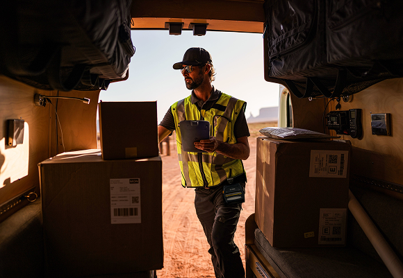 T&L warehouse with rugged endpoint devices being managed by TRG technicians