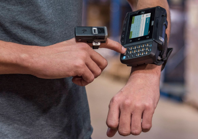 Employee using Zebra wearable computer and ring scanner to manage tasks hands-free