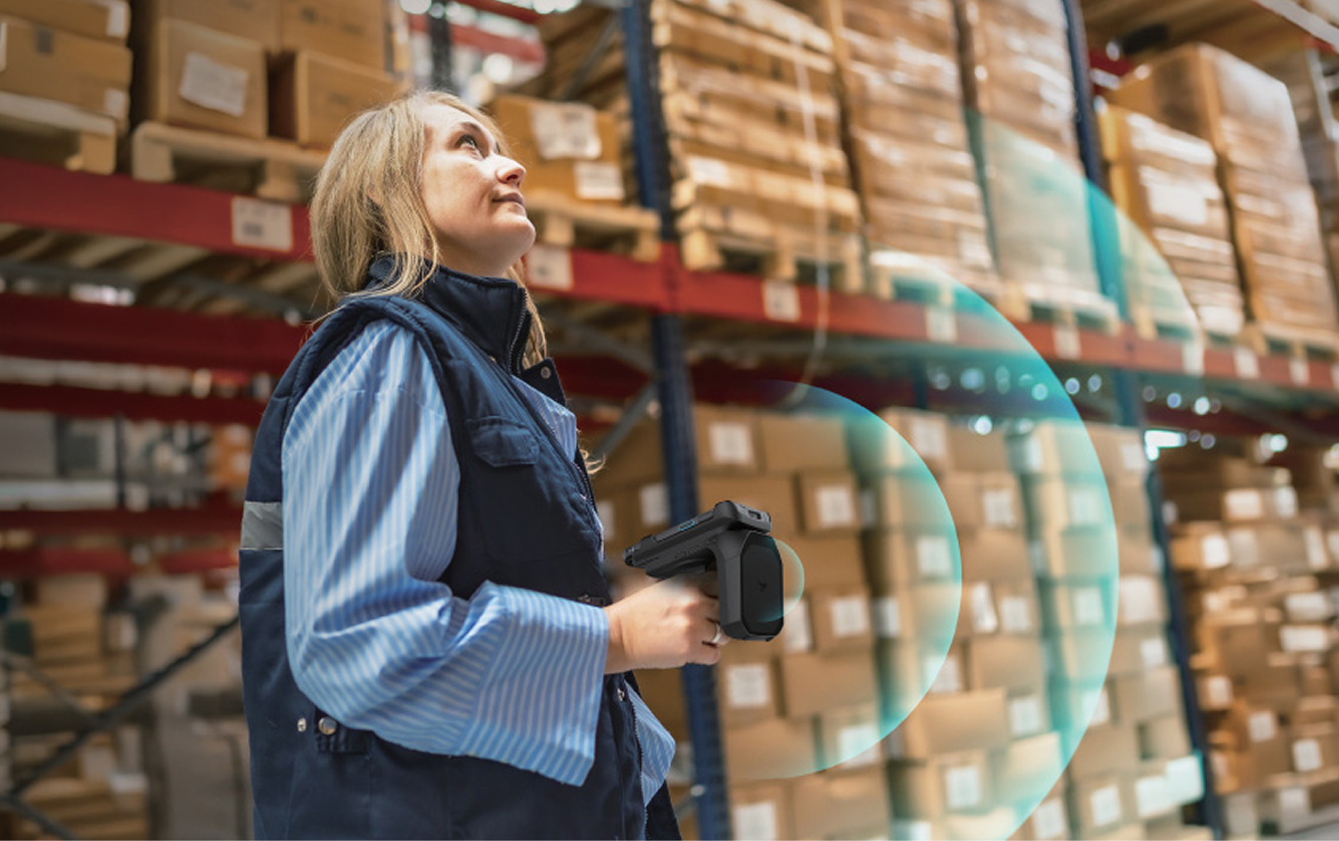 Warehouse associate scanning shelves with a TSC handheld RFID reader