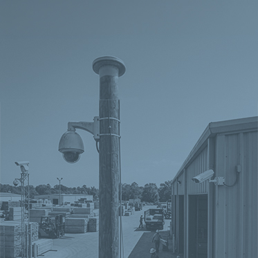 Security camera overlooking a lumber yard